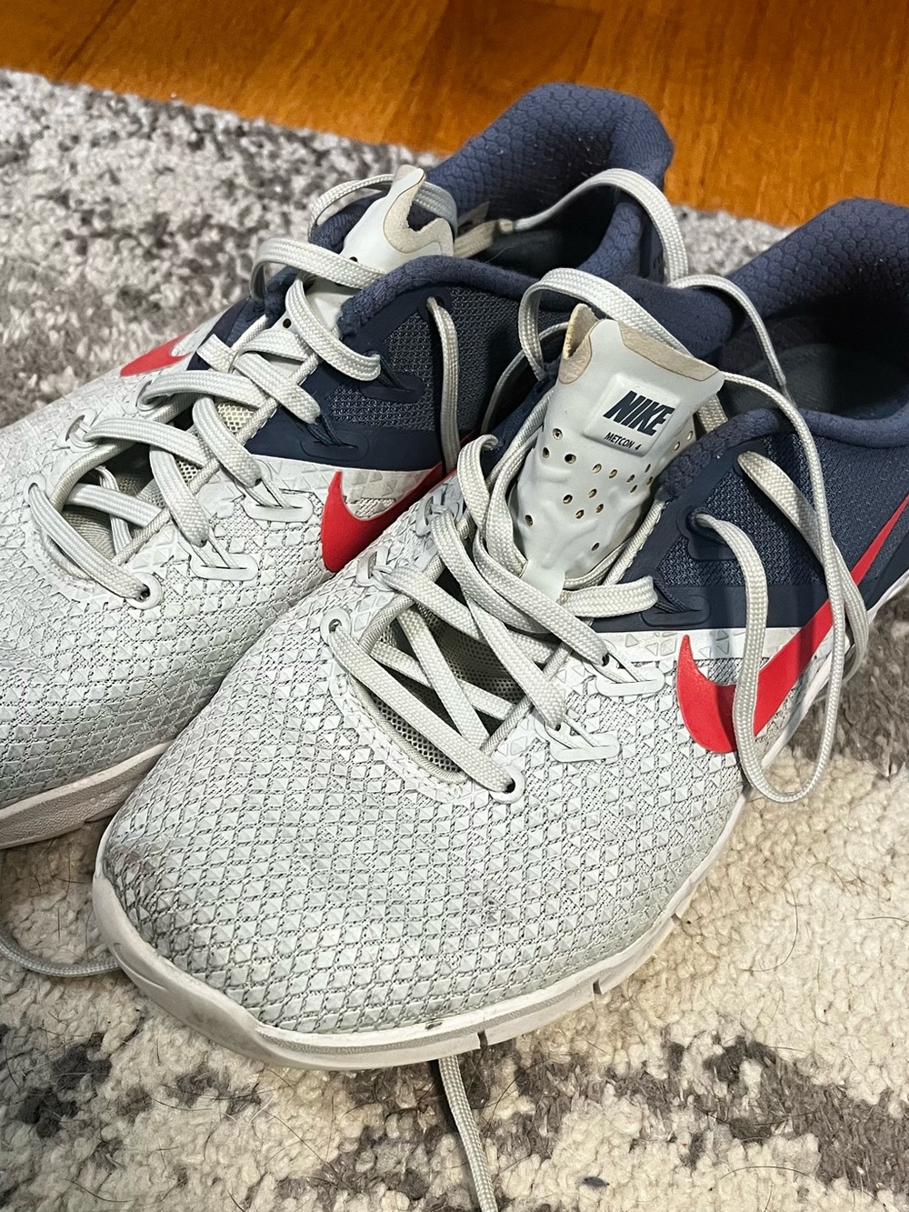 Nike Women’s Metcon Light Gray and Navy Athletic Shoes with Red Swoosh